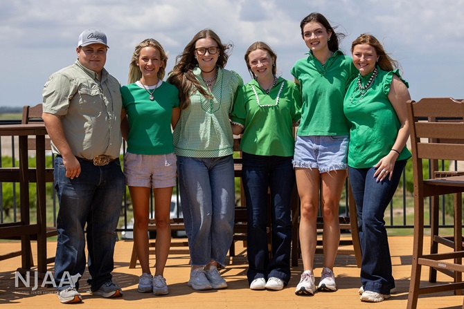 NJAA participants posing for a group photo on a deck.