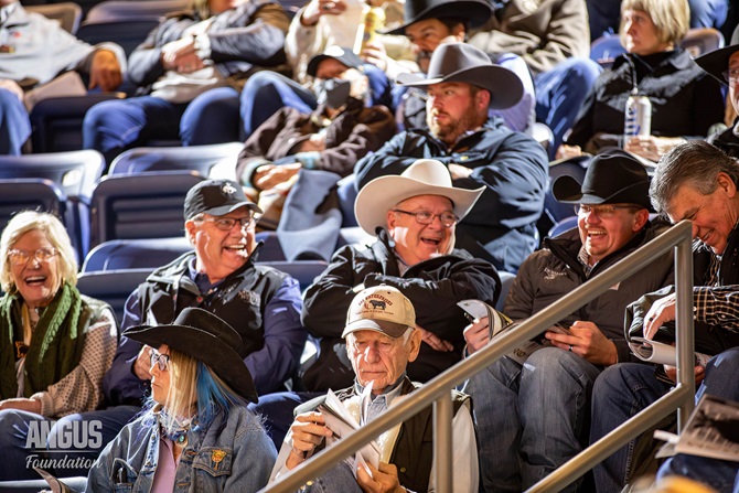 Attendees in the facility gather and laugh for the Angus Foundation sale.
