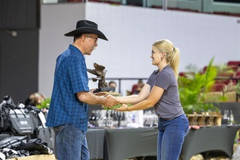 Paige Lemenager receiving the Outstanding Leadership Award during closing ceremonies at National Junior Angus Show.