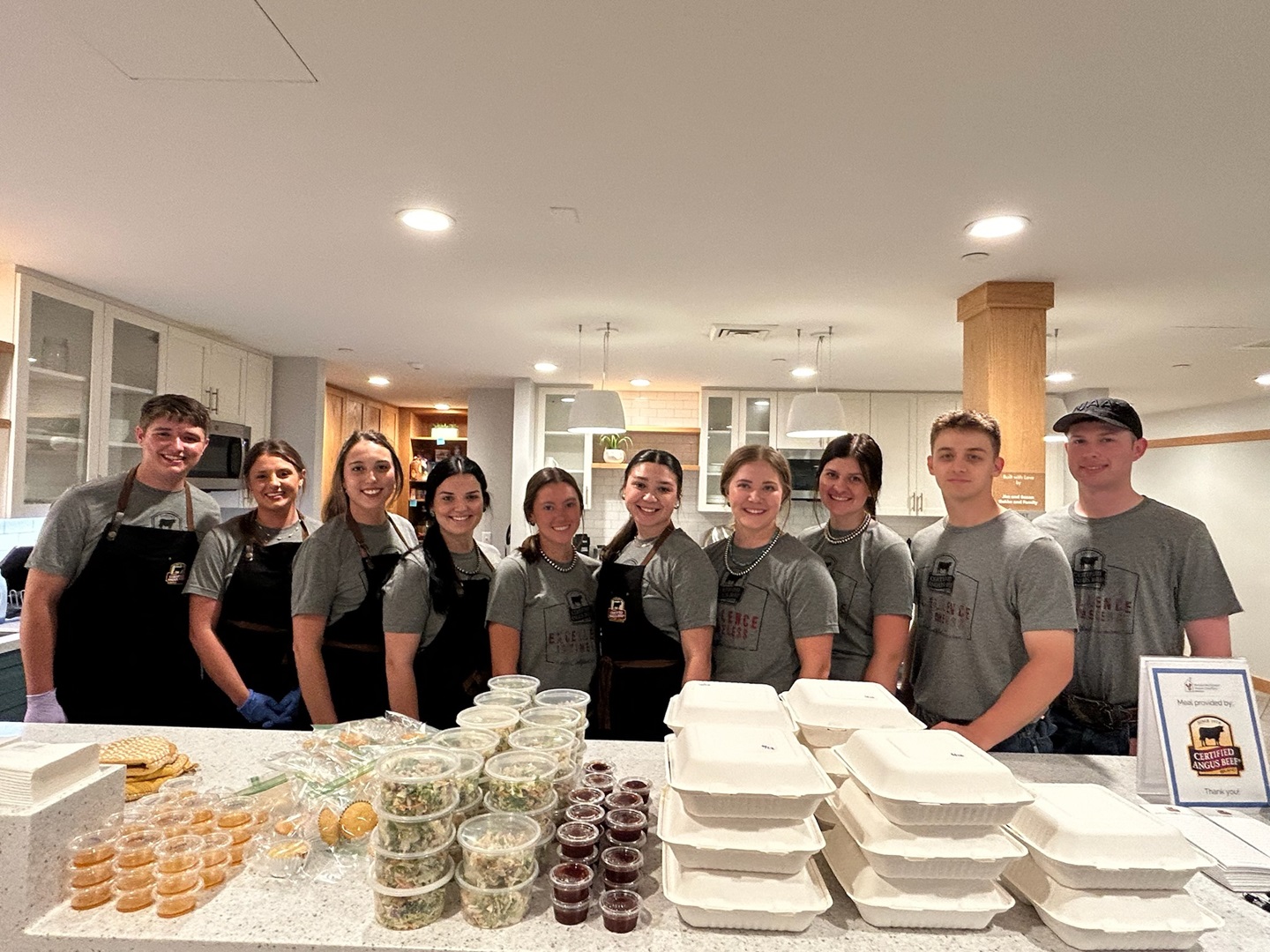 National Junior Angus Board members serving a meal at the Ronald McDonald House in Madison, Wisconsin.