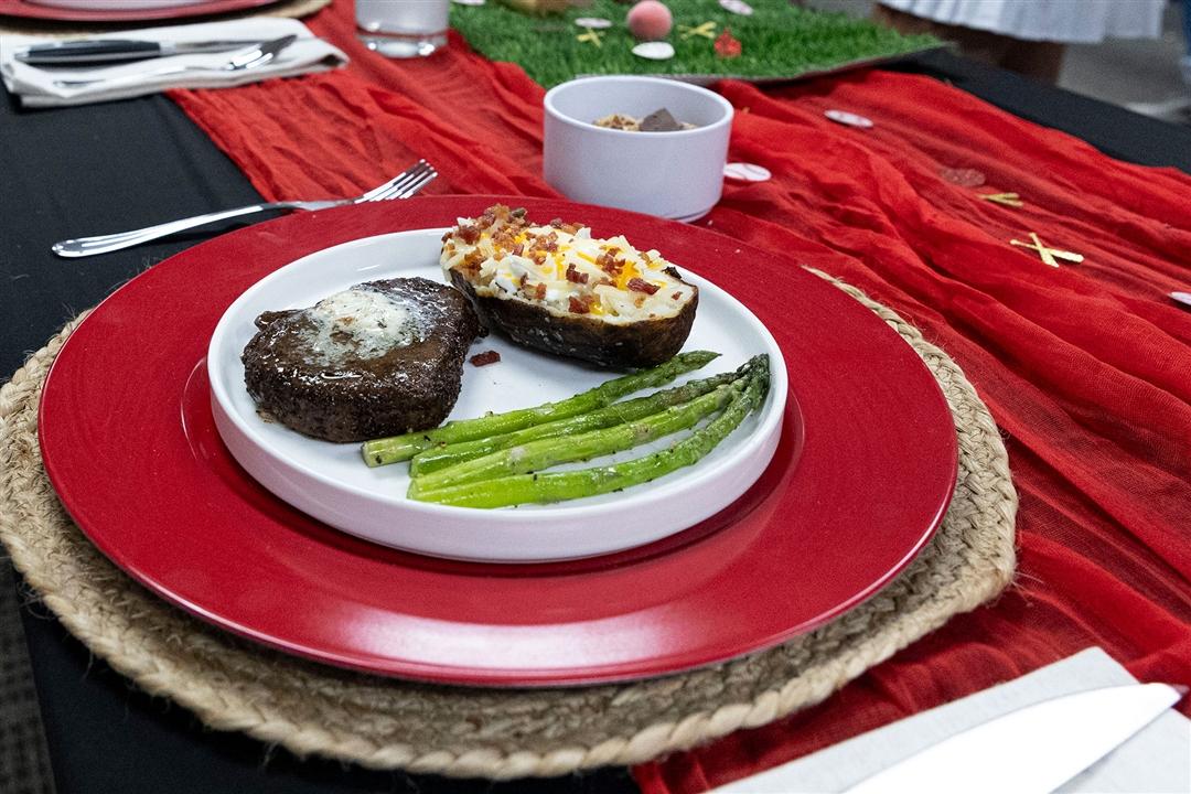  Missouri Senior Steak team plate up a coffee-crusted baseball-cut steak, loaded baked potato and asparagus for the recipe portion of the All-American Certified Angus Beef ® Cook-Off contest. 