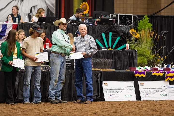 Scholarship award being presented to recipient.