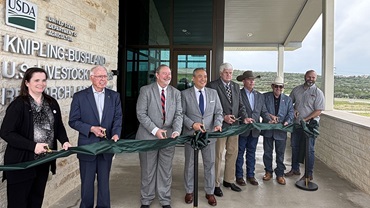 several people doing a ribbon-cutting 