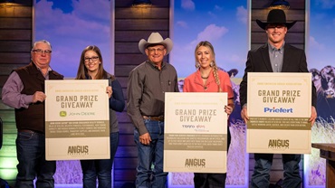 Braden Forker of Nebraska won a Priefert S04 squeeze chute at the 2025 Angus Convention in Kansas City, alongside Dale Jenkins of Texas, winner of a Trans Ova service voucher, and Doug Velisek of Maryland who won a John Deere Gator™ XUV 845M crossover utility vehicle.    Pictured from left: Do