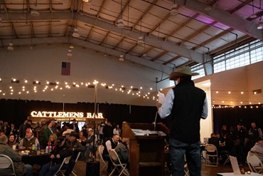 Speaker in front of a large room.