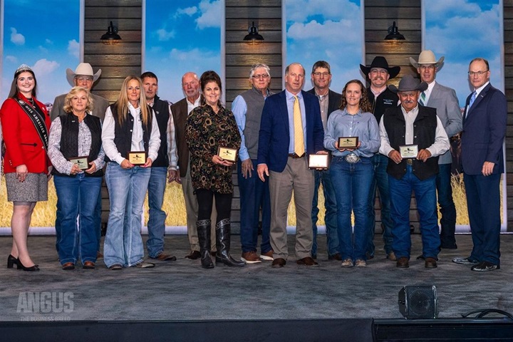 The 2025 Data Driven Herd recognized recipients stand with their plaque at the 2025 National Angus Convention banquet.