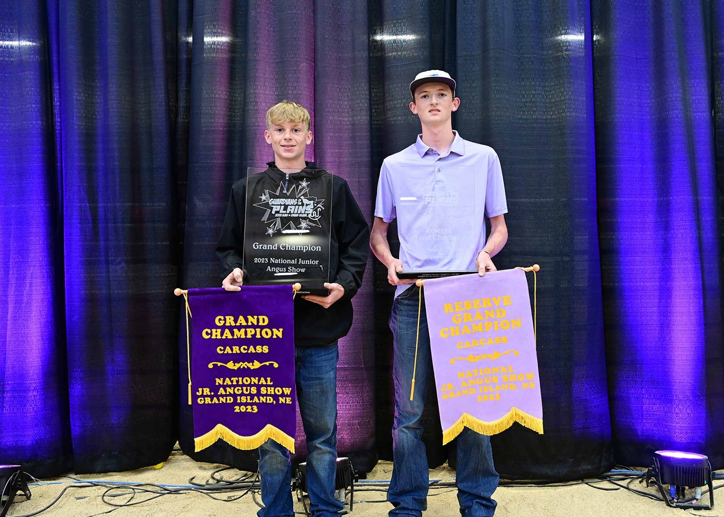 Owen Austrino was awarded champion carcass steer and Brazos Worrell was awarded reserve carcass steer at the 2023 National Junior Angus Show in Grand Island, Neb. Pictured from left are Owen Austrino, Dade City, Fla., and Pecos Worrell, accepting on behalf of Brazos Worrell, Harper, Texas.