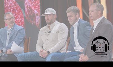 Men on stage at Certified Angus Beef event. 