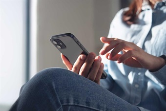 A woman texting on her phone.