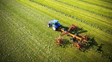 tractor in hay field