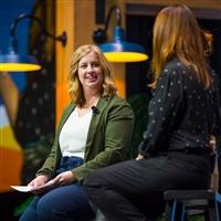 Kelli Retallick-Riley, President, Angus Genetic Inc. (AGI®), has a conversation with another woman on the stage at Angus Convention.