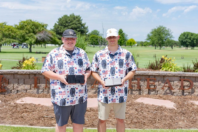 Group of two men on a golf tournament team.