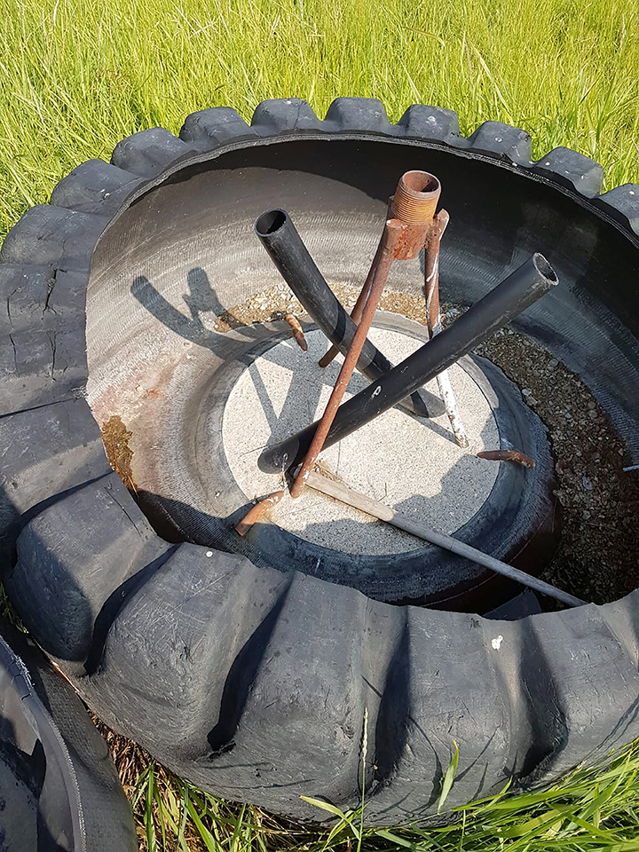 To provide water in winter, Gerald Vandervalk uses a tire trough with water coming up through the bottom and two overflow pipes carrying it away. Even in very cold weather, the constant water movement and volume keeps some surface area open.