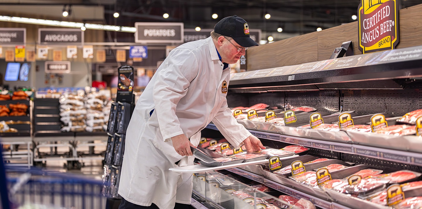 stocking the meat counter