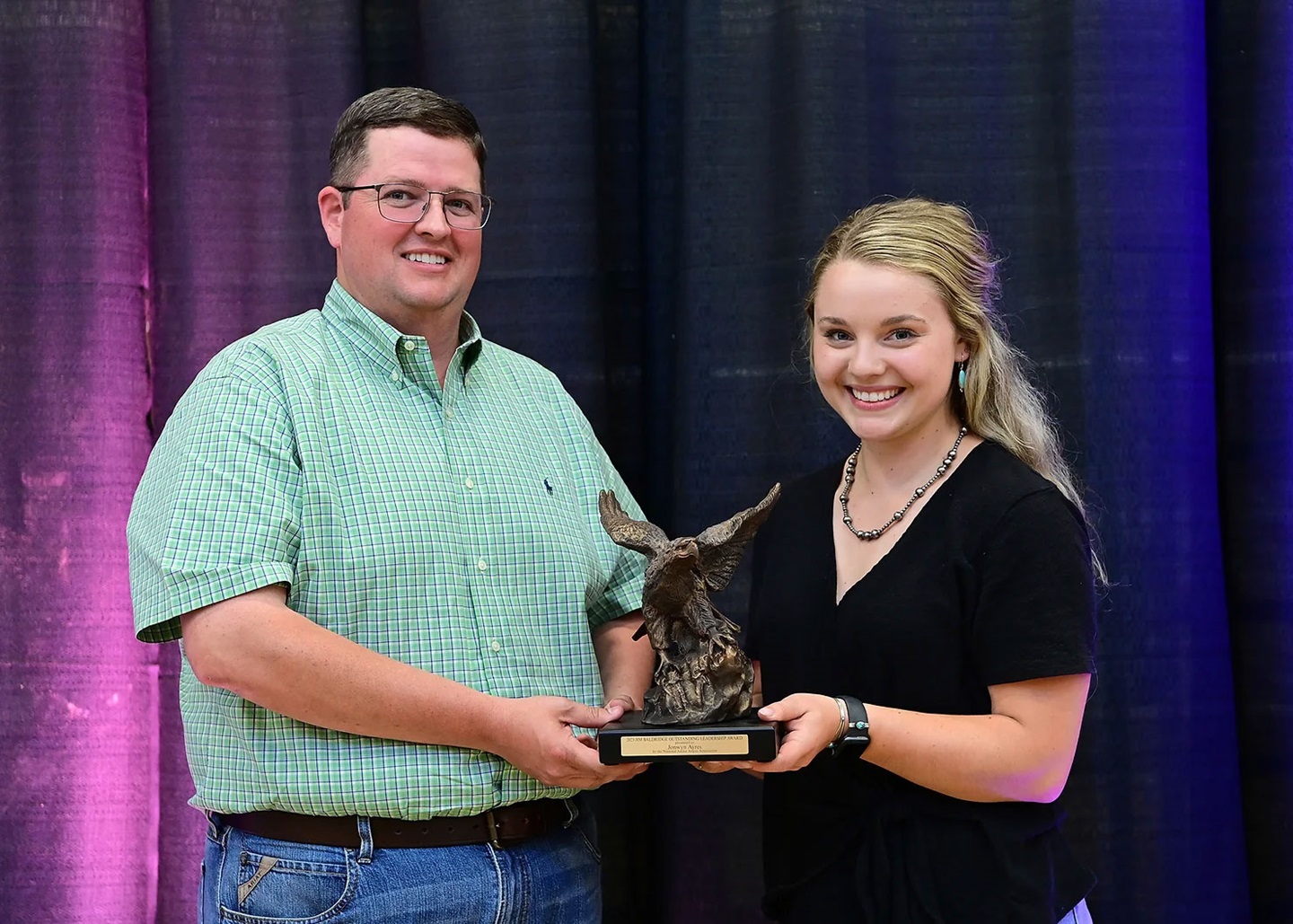 man giving girl award