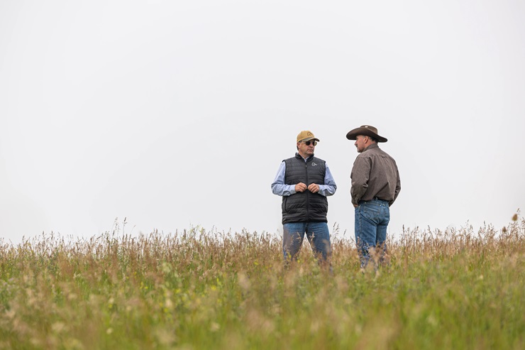 two men in pasture