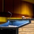 An up-close image of a podium at a conference center and a microphone.