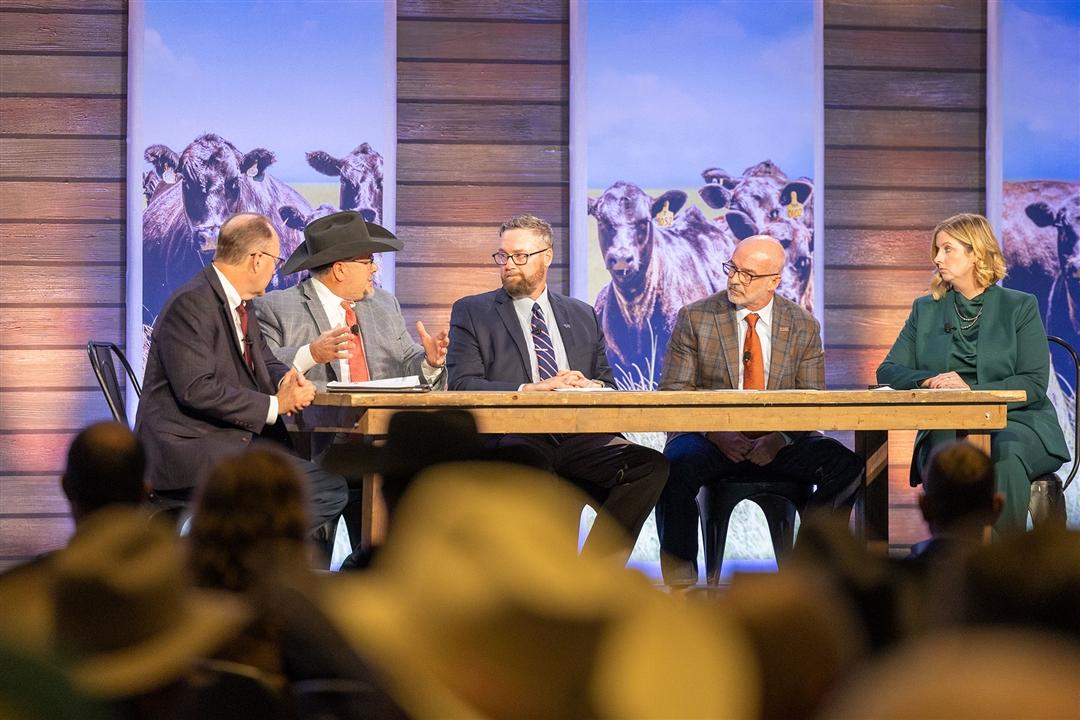 Outgoing president and chairman of the American Angus Association Board of Directors, Jonathan Perry of Tennessee, speaks during a general session on November 1 during the 2025 Angus Convention in Kansas City, Missouri. From left, pictured are Mark McCully, CEO of the American Angus Association; Perry; John Dickinson, chairman of Angus Genetics Inc (AGI®); Smitty Lamb, chairman of the Breed Improvement Committee; and Kelli Retallick-Riley, president of AGI.