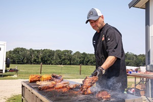 A man grills steaks